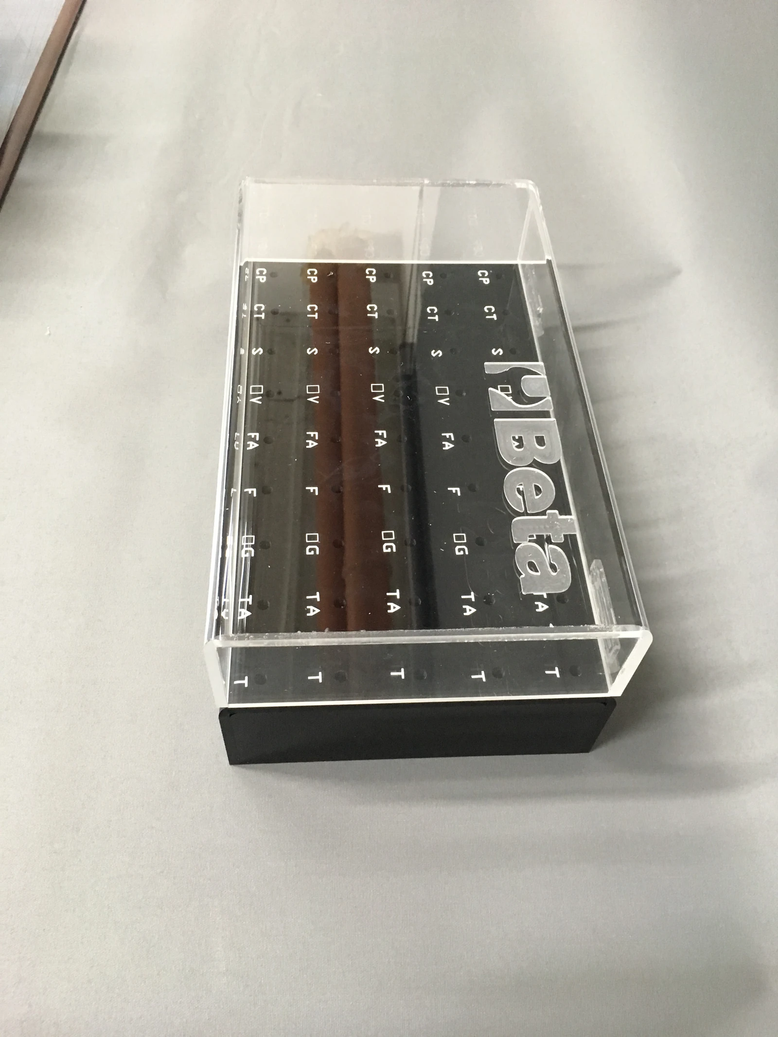 Beta — Acrylic display for exposing tools or small items, with black shelves and transparent walls