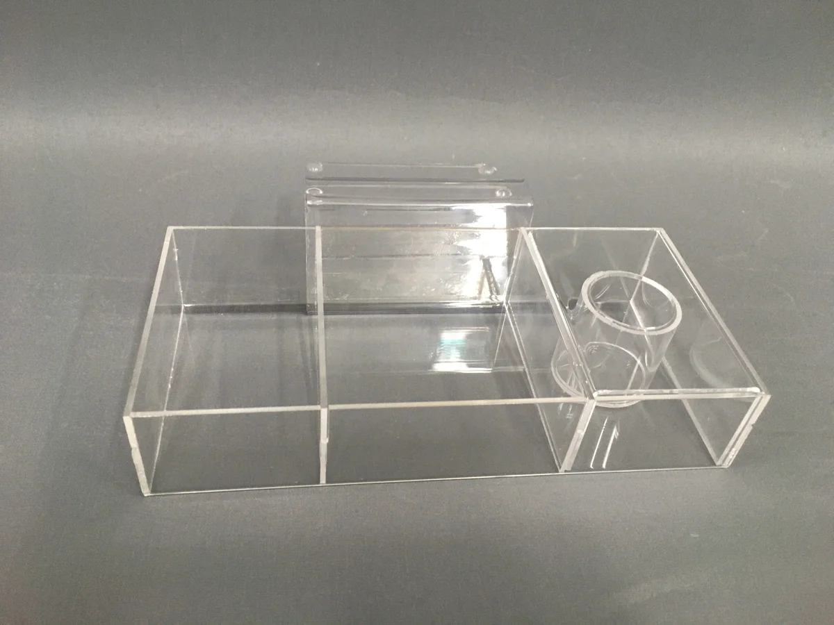 Multi-compartment container from clear acrylic — three compartments with a separate bottom