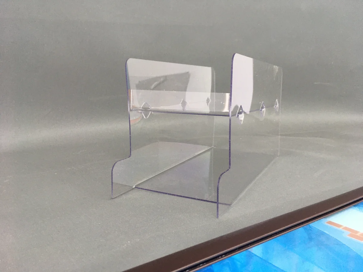 Small product base — clear acrylic with hooks