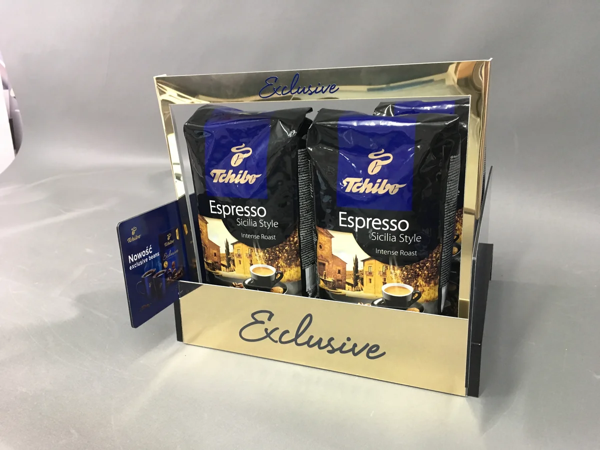 Tchibo Exclusive coffee display — gold mirror acrylic with UV print