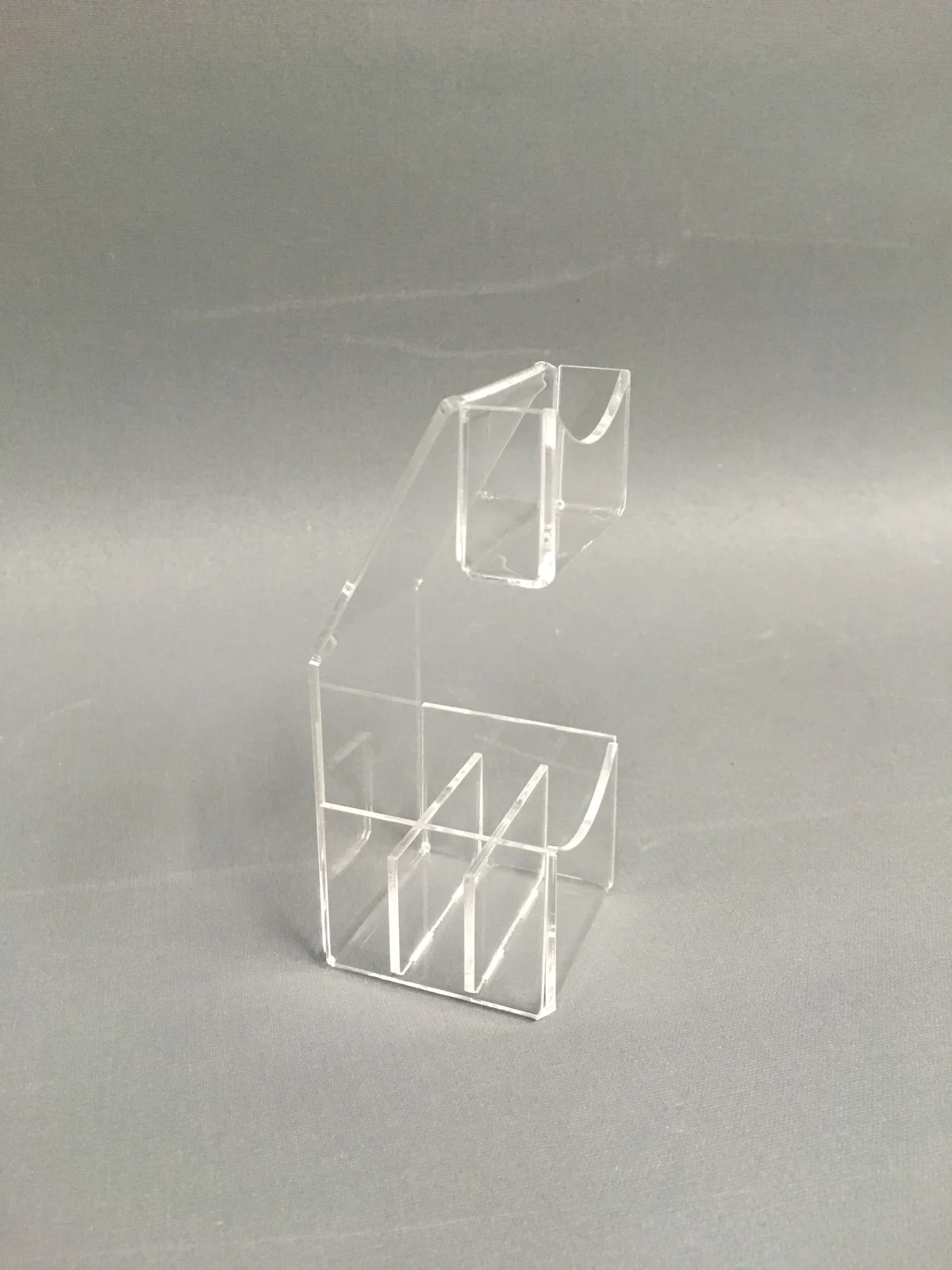 Small personal display from clear acrylic — single pocket with a shelf