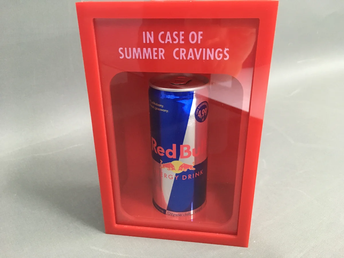 Energy drink display from red acrylic from opening lid