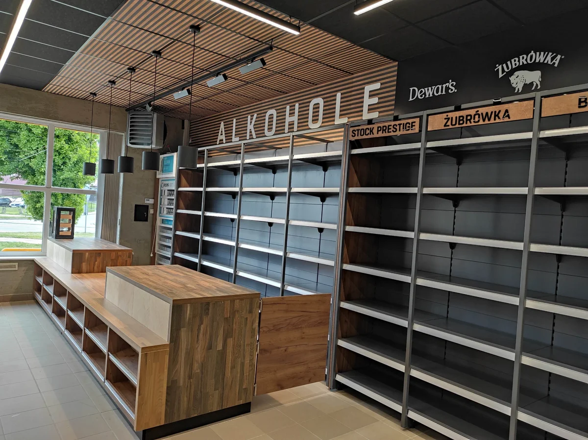 Liquor store interior from meblami and shelving from inscription ALKOHOLE