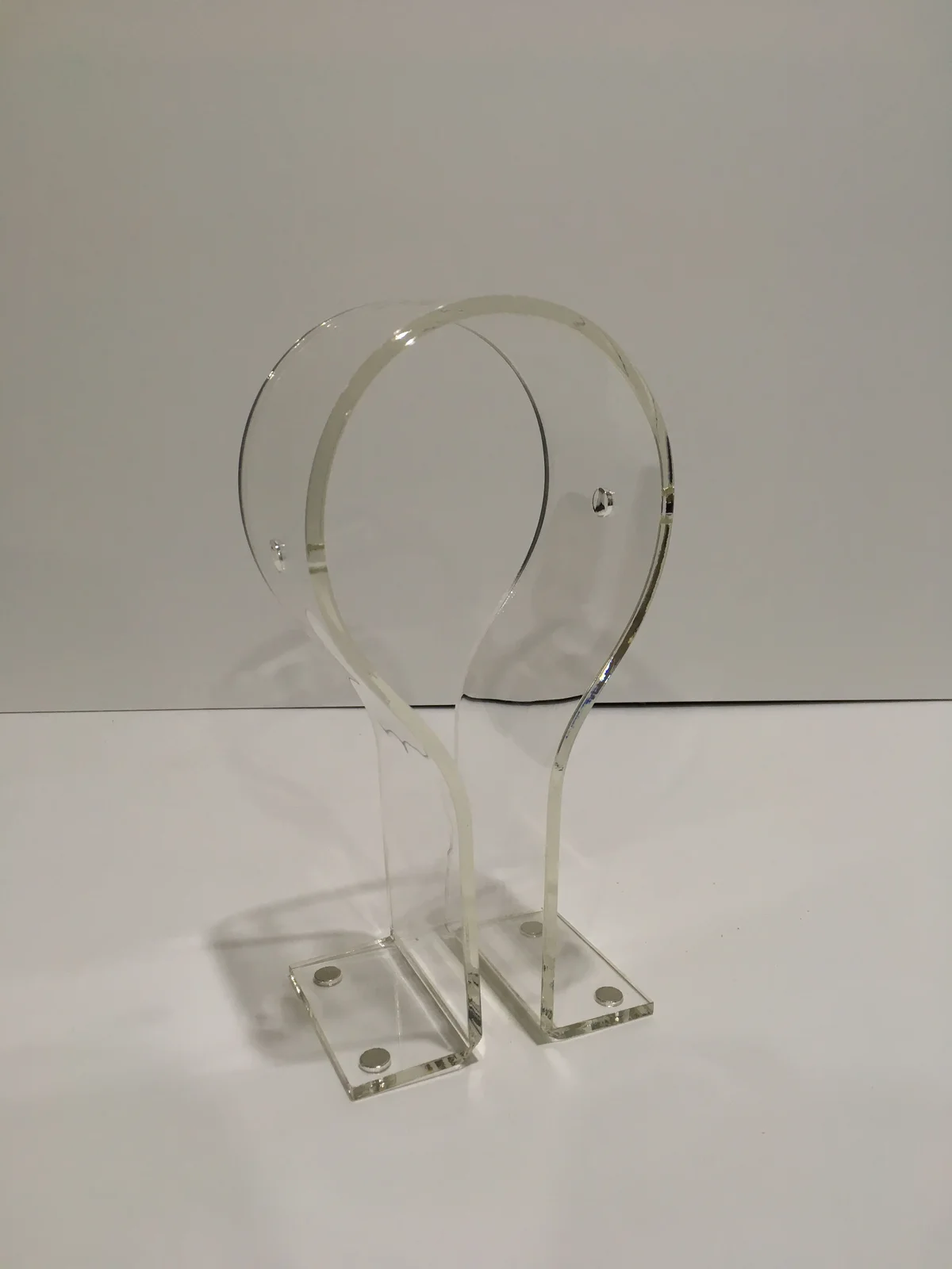 Headphone stand in clear acrylic with magnets in the base