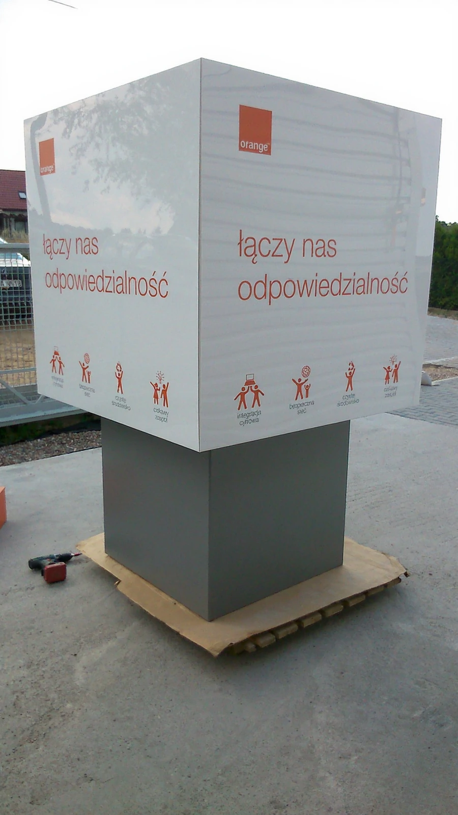 Orange advertising display with handprints of employees of the year