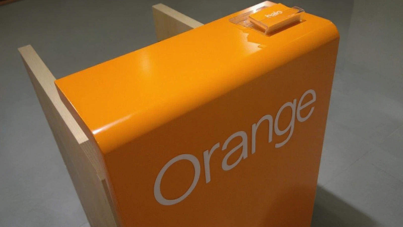 Counter fit-out from orange acrylic with white lettering