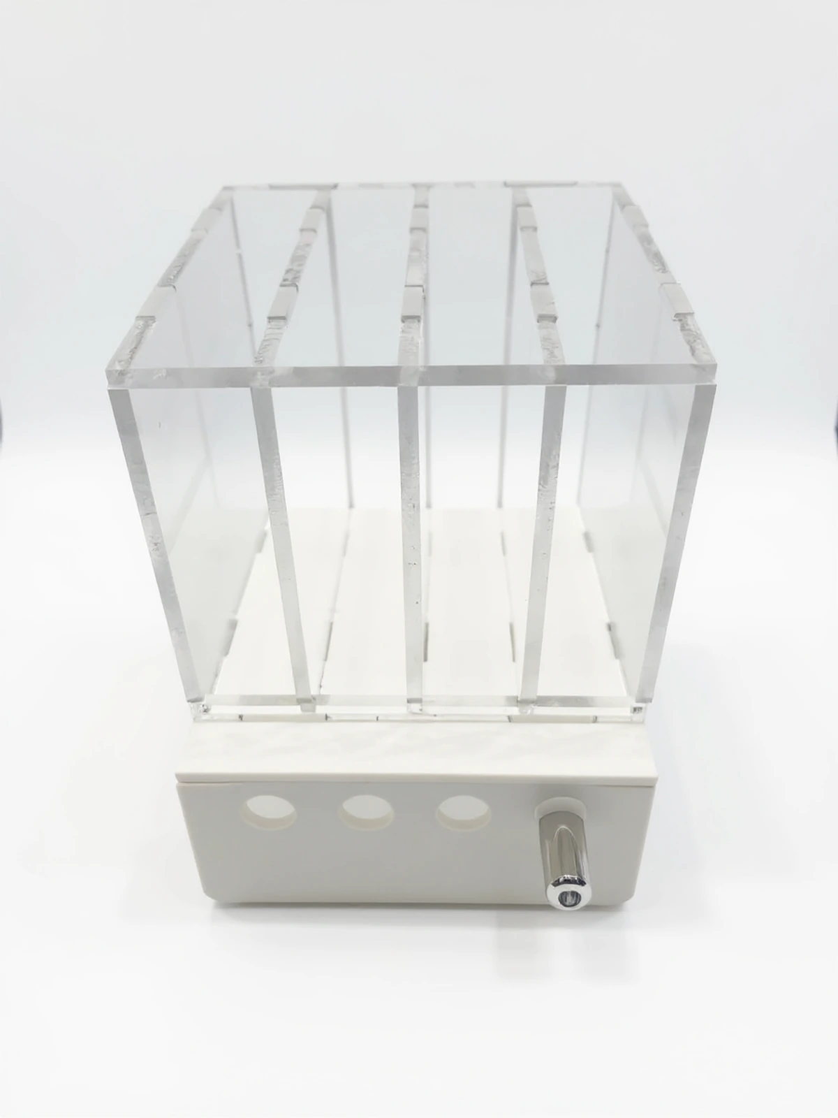 PlexiSystem — Lightbox/display from acrylic from compartments, transparent, z white base and separatorami for display products.