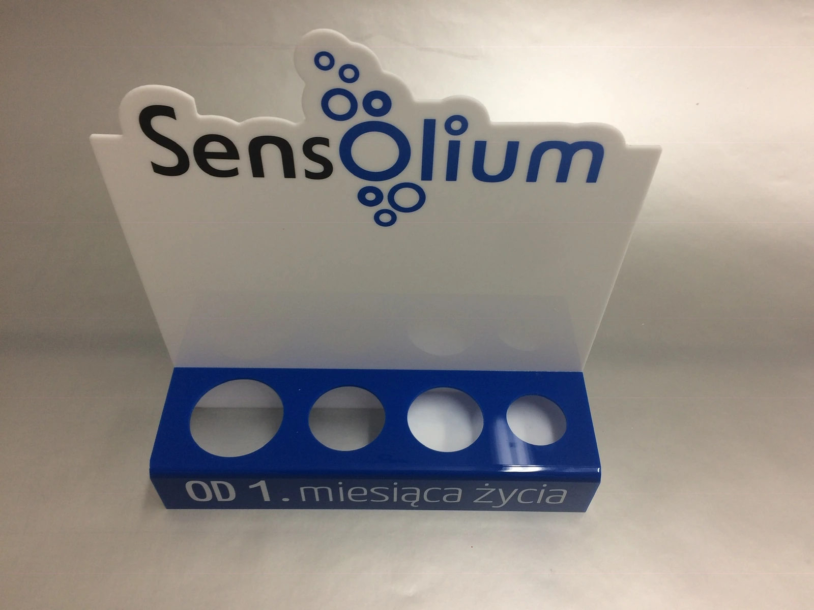 Sensolium — Display/lightbox from acrylic for presenting products, white from blue frontem, 4 round holes, intended for ekspo