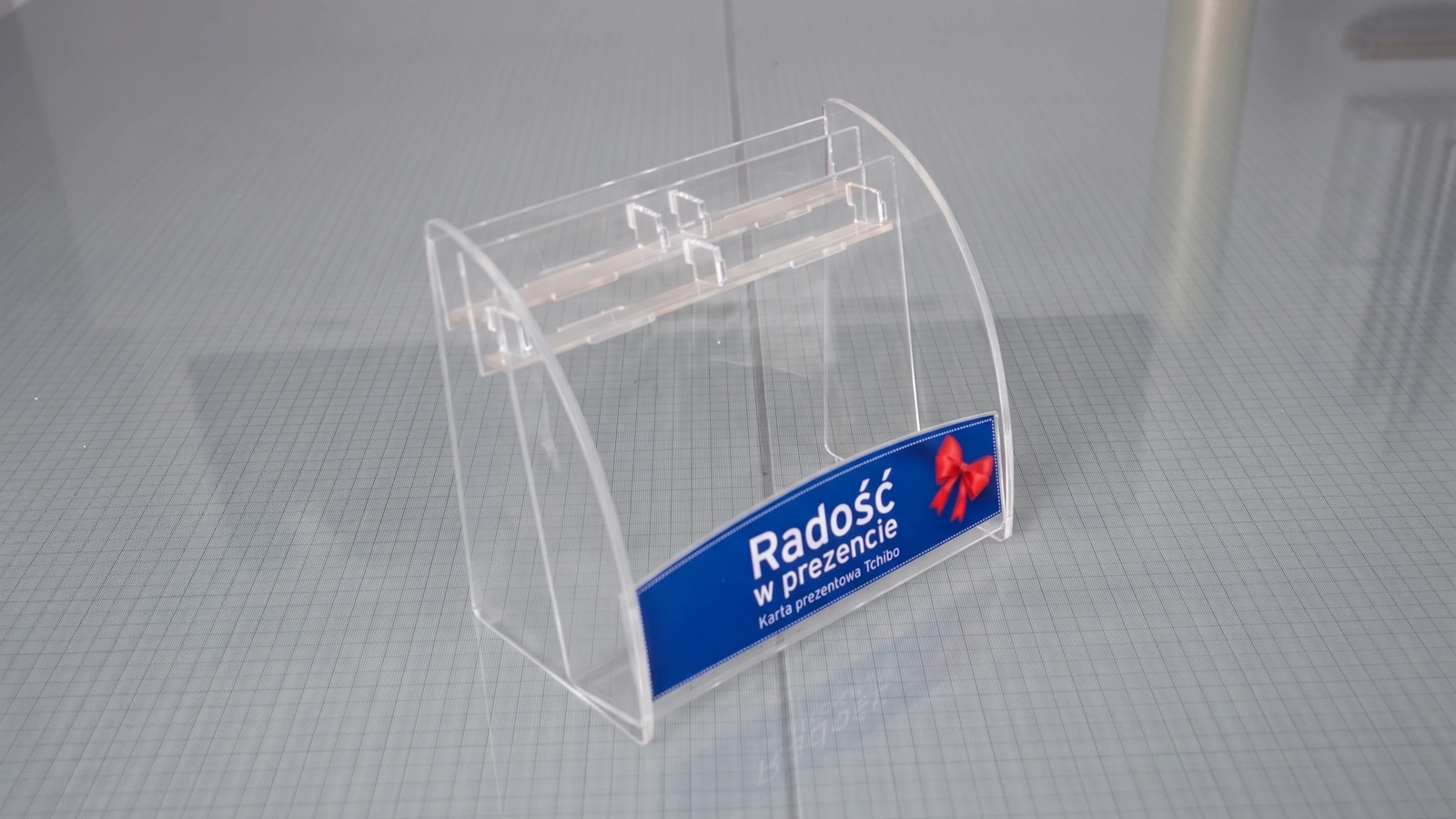 Tchibo display — transparent acrylic showcase for presenting promotional materials, PlexiSystem